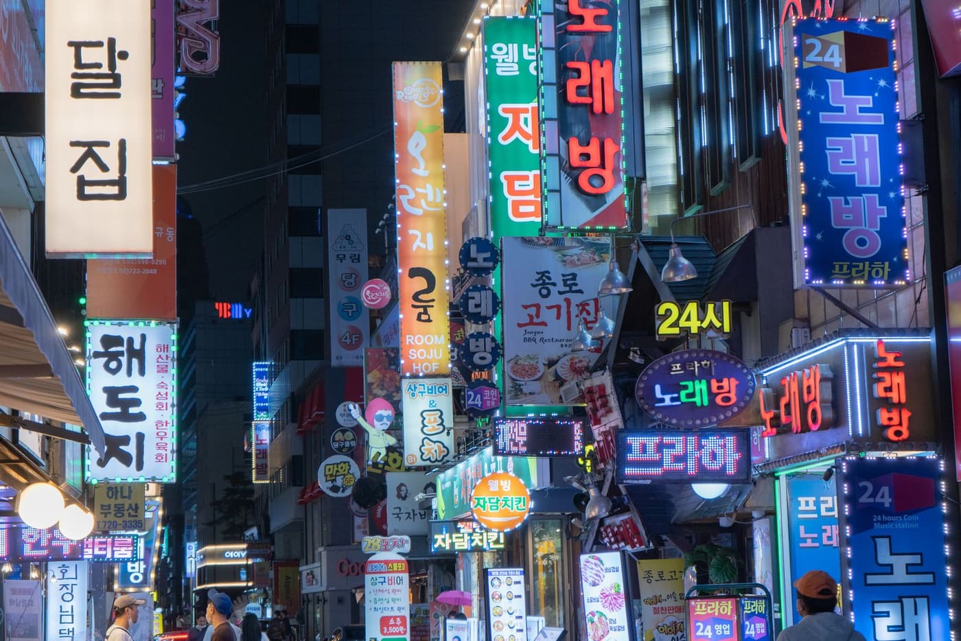 Myeongdong shopping street with neon signs at night, Seoul